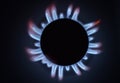 Natural gas burning a blue flames on black background Royalty Free Stock Photo