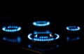 Natural gas burning, blue flames on black background Royalty Free Stock Photo