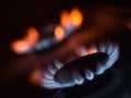 Natural gas burning a blue flames on black background Royalty Free Stock Photo