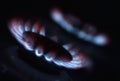 Natural gas burning a blue flames on black background Royalty Free Stock Photo