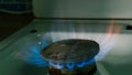 Natural gas burning. Fire from old burner stove top, in domestic kitchen for cooking with  flames propane gas or methane burning. Royalty Free Stock Photo