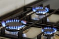 Natural gas burning on kitchen gas stove in the dark. Panel from Royalty Free Stock Photo