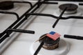Natural gas exports and imports. High price. Flag of the United States of America on gas stove Royalty Free Stock Photo