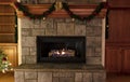 Natural gas fireplace, ceramic logs, decorated for a Merry Christmas or a Happy New Year concept Royalty Free Stock Photo