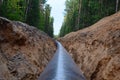 Natural gas pipeline construction work. A dug trench in the ground for the installation and installation of industrial gas Royalty Free Stock Photo