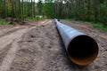 Natural gas pipeline construction work. A dug trench in the ground for the installation and installation of industrial gas and oil Royalty Free Stock Photo