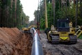 Natural gas pipeline construction work. A dug trench in the ground for the installation and installation of industrial gas and oil Royalty Free Stock Photo