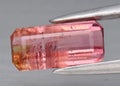 Natural gem pink tourmaline on gray background Royalty Free Stock Photo