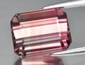 Natural gem pink tourmaline on gray background Royalty Free Stock Photo