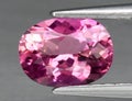Natural gem pink tourmaline on gray background Royalty Free Stock Photo