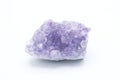 Natural gem purple amethyst isolated on white background. Crystal Stone macro mineral, purple rough amethyst quartz crystals on Royalty Free Stock Photo