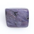 Natural gemstone purple charoite isolated on white background Royalty Free Stock Photo