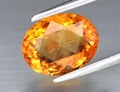 Natural gemstone yellow citrine on gray background Royalty Free Stock Photo
