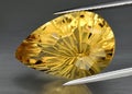 Natural gem yellow citrine on gray background