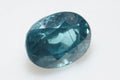 Natural gemstone blue zircon on background