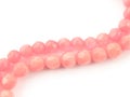 Natural gemstone pink coral beads on a white background Royalty Free Stock Photo