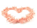 Natural gemstone pink coral beads on a white background Royalty Free Stock Photo