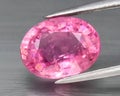 Natural gemstone pink tourmaline on gray background Royalty Free Stock Photo