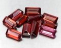 Natural gemstone rhodolite garnet isolated on the white background