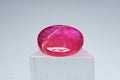 Natural gemstone ruby on a stand white background