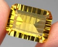 Natural gemstone yellow citrine on gray background Royalty Free Stock Photo