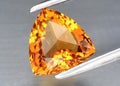Natural gemstone yellow citrine on gray background Royalty Free Stock Photo