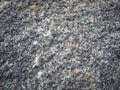 Natural granite stone texture in close-up flat lay with sharp focus. Royalty Free Stock Photo