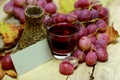 Natural grape red juice homemade wicker bottle and grapes Royalty Free Stock Photo