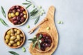 Natural greek olives in bowls with kitchen board from olive tree top view. Royalty Free Stock Photo