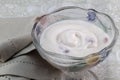 Natural greek yoghurt with berries mixed in lovely glass bowel w Royalty Free Stock Photo