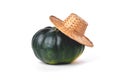 Natural green pumpkin, straw village hat, on a white background