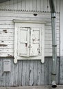 Natural grey and white old house wall with wood closed up white window, mailbox and tin waterpipe Royalty Free Stock Photo