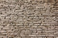 Natural grunge brown stone wall background and texture.