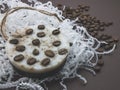 Natural handmade coffee scented round soap on the background of white crinkle shredded paper and coffee beans Royalty Free Stock Photo