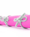 Natural handmade cord knots tied on pink message scroll isolated Royalty Free Stock Photo