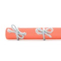 Natural handmade rope bows tied on orange paper roll isolated Royalty Free Stock Photo