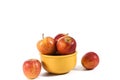 Natural and healthy apples tropical fruit inside a yellow pot isolated on bench background