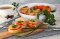 Natural healthy food. Sandwiches on a wooden background for tea. Hot homemade sandwiches with sausage, tomatoes and cheese Royalty Free Stock Photo