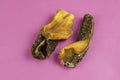 Natural healthy treats for dogs of premium quality. Dried beef stomach, buffalo tripe on a pink background