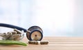 Natural herbal medicine capsules with stethoscope on wood table front Royalty Free Stock Photo