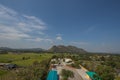 Natural high angle views, rice fields with sky and mountains behind Kanchanaburi, Thailand