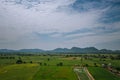 Natural high angle views, rice fields with sky and mountains behind Kanchanaburi, Thailand