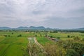 Natural high angle views, rice fields with sky and mountains behind Kanchanaburi, Thailand