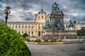 Natural History Museum in Vienna with green hedge and monument in cloudy background and street lamp Royalty Free Stock Photo