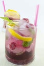 Natural homemade red forest fruit iced-T juice with ice, lemon a