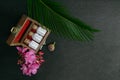 Natural Homeopathic medicine concept - Close view of homeopathy medicine bottles in wooden old box with pink flower, wild flower
