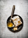Natural honey comb with a vintage spoon. Royalty Free Stock Photo