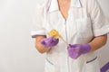 Natural honey sugar paste shugaring closeup. Women beautician holds jar wax of paste for sugar depilation shugaring