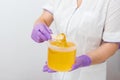 Natural honey sugar paste shugaring closeup. Women beautician holds jar wax of paste for sugar depilation shugaring