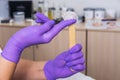 Natural honey sugar paste shugaring closeup. Women holds spatula with paste for shugaring depilation Royalty Free Stock Photo